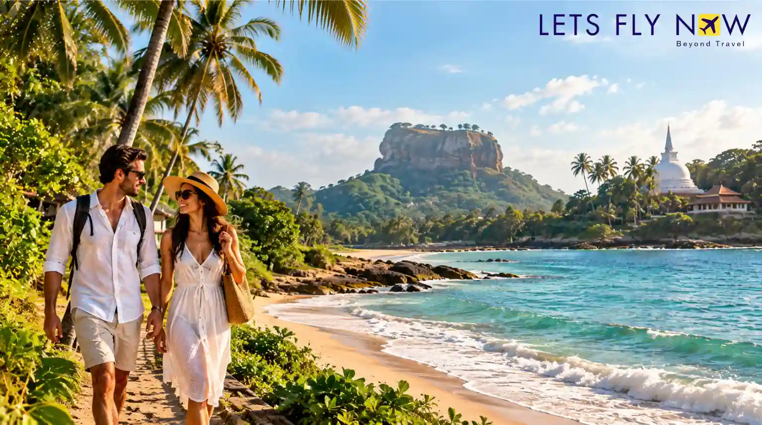 Couple walking along a tropical beach in Sri Lanka with palm trees, turquoise water and a distant rocky landmark.